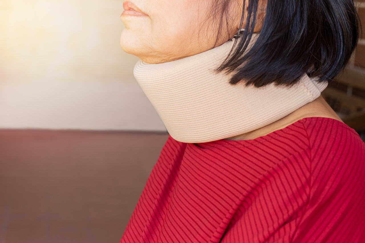 An elderly woman with whiplash