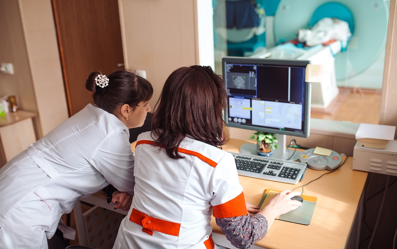 Two doctors looking at the results of an MRI scan