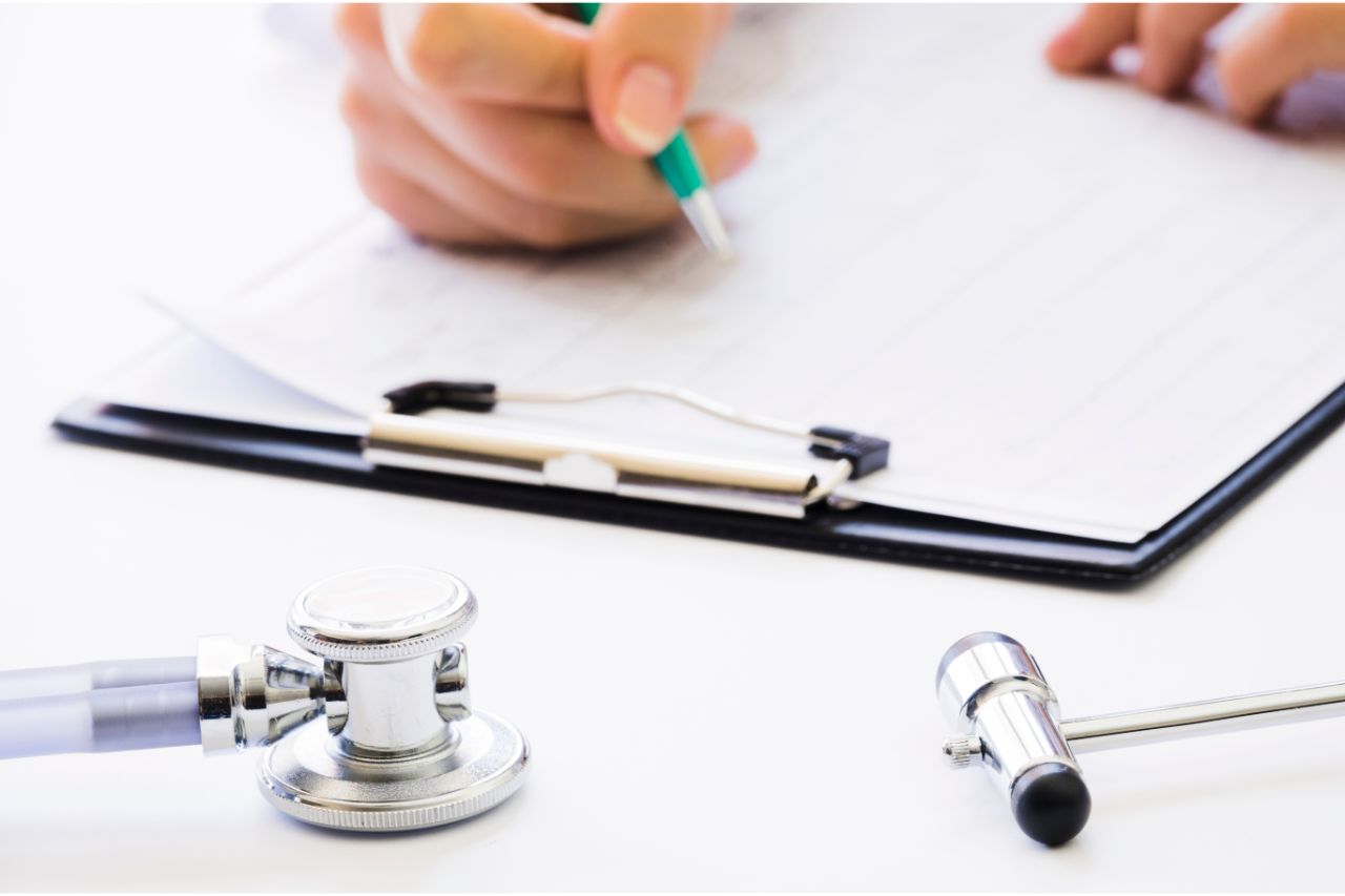 Close up of doctor writing patient details
